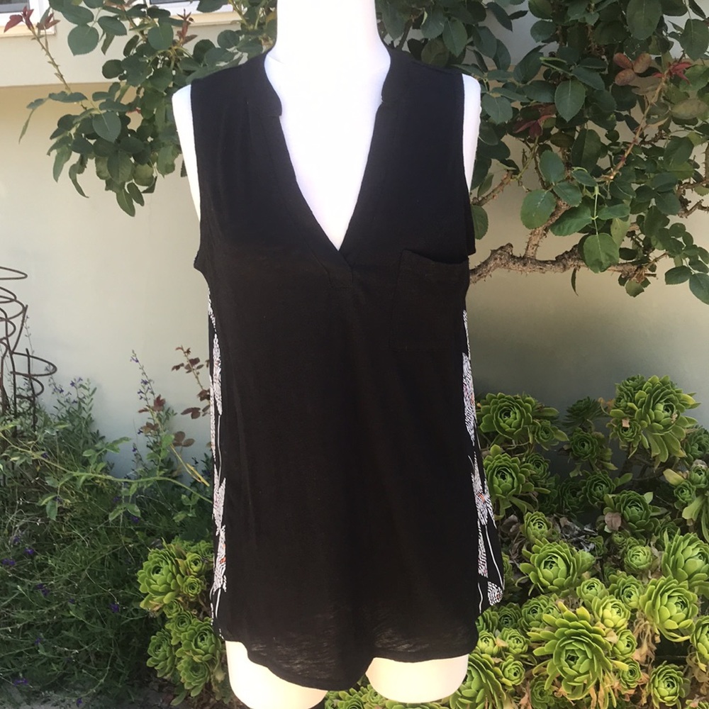 NWT tunic length tank with pattern in back.